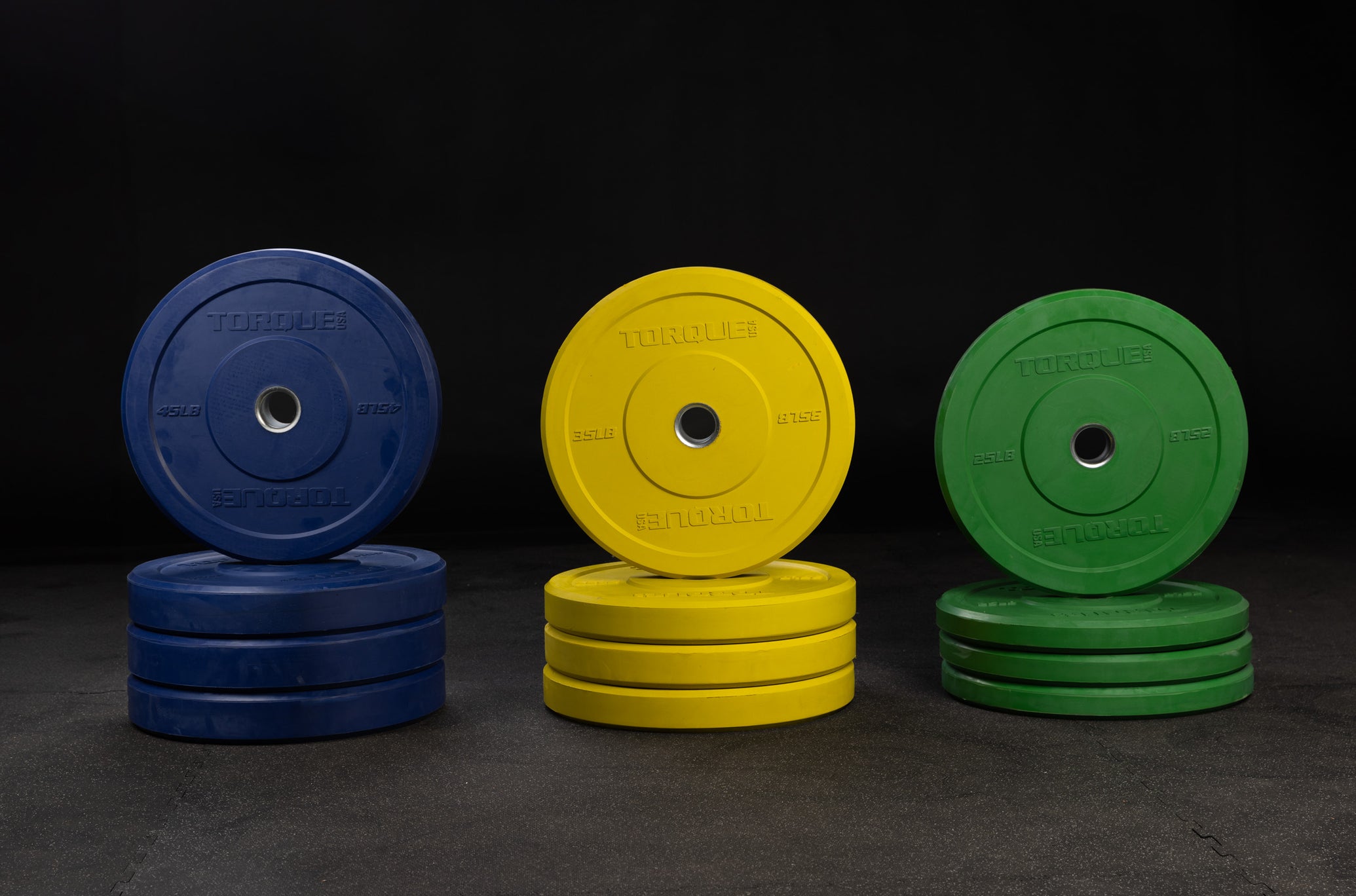 X-GYM Colored Bumper Plate Pairs - $1/LB